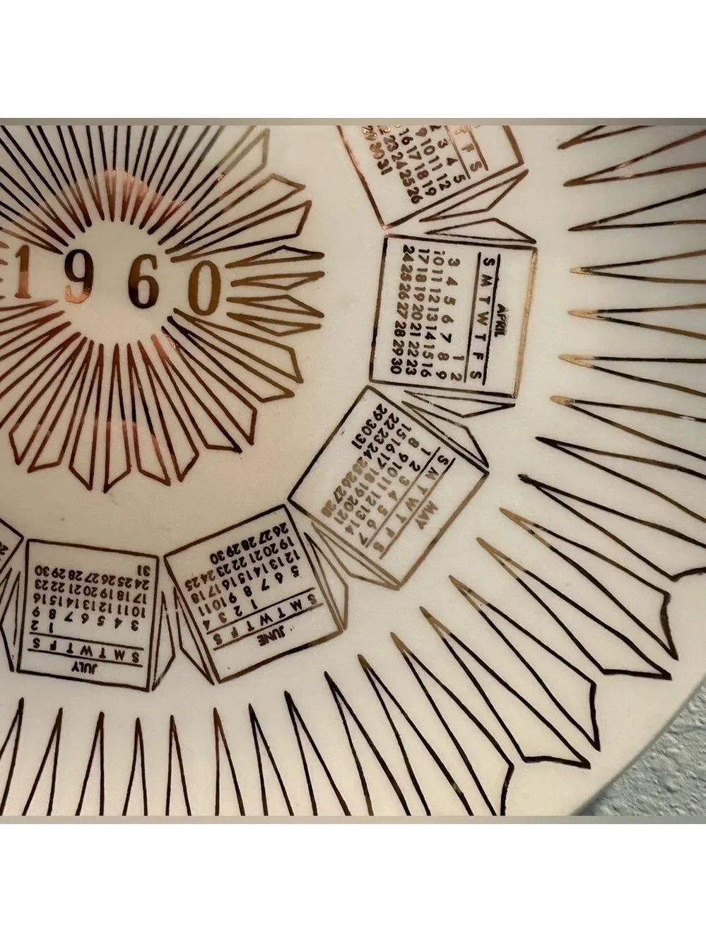 Vintage 1960 Calendar plate. Excellent shape. Wall hanger included. White + Gold